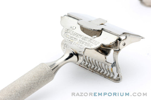 1930s Gem Minute Man Metal Wall Hanger with Single Edge Razor